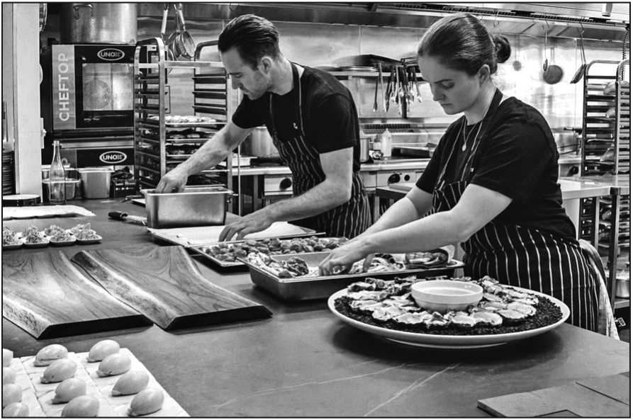 Two young restaurant workers
