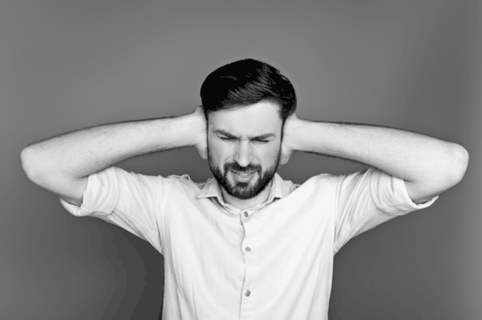 A man suffering from loud noise