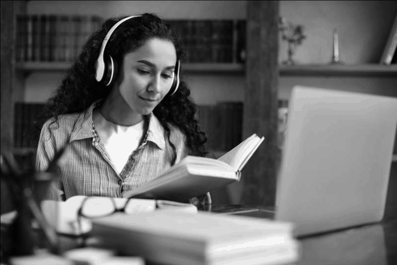 A student listening to music while she studies